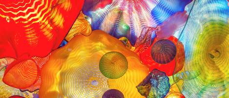 A close-up of colorful glass sculptures with intricate patterns and textures.