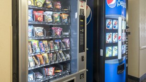 A vending machine with snacks and a Pepsi dispenser. - Red Roof Inn Jackson, OH (Jackson)