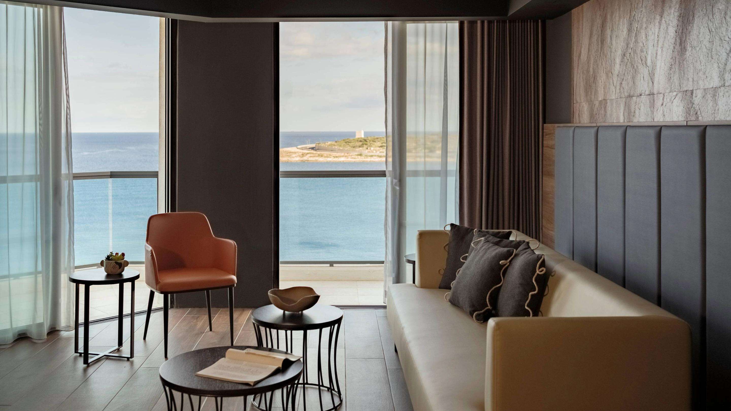 junior suite, 1 king bed, sea view | 1 bedroom, minibar, in-room safe, blackout curtains