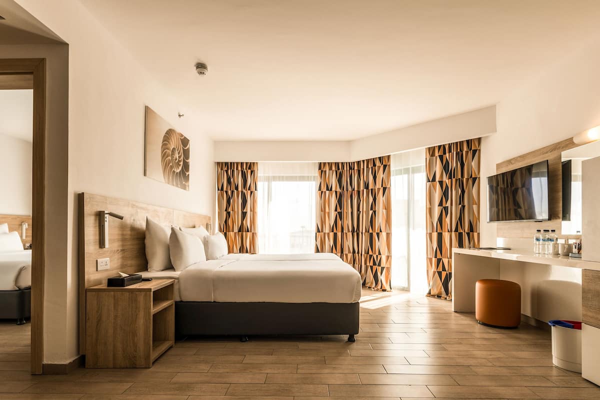 family room, sea view | 1 bedroom, minibar, in-room safe, blackout curtains