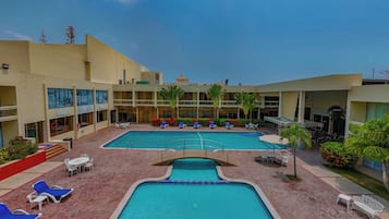 Outdoor pool, open 8:00 AM to 10:00 PM, pool umbrellas, sun loungers