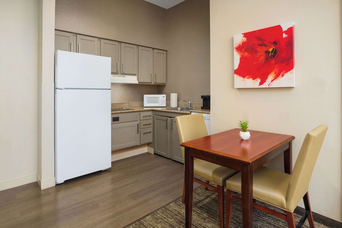 full-sized fridge, microwave, stovetop, dishwasher