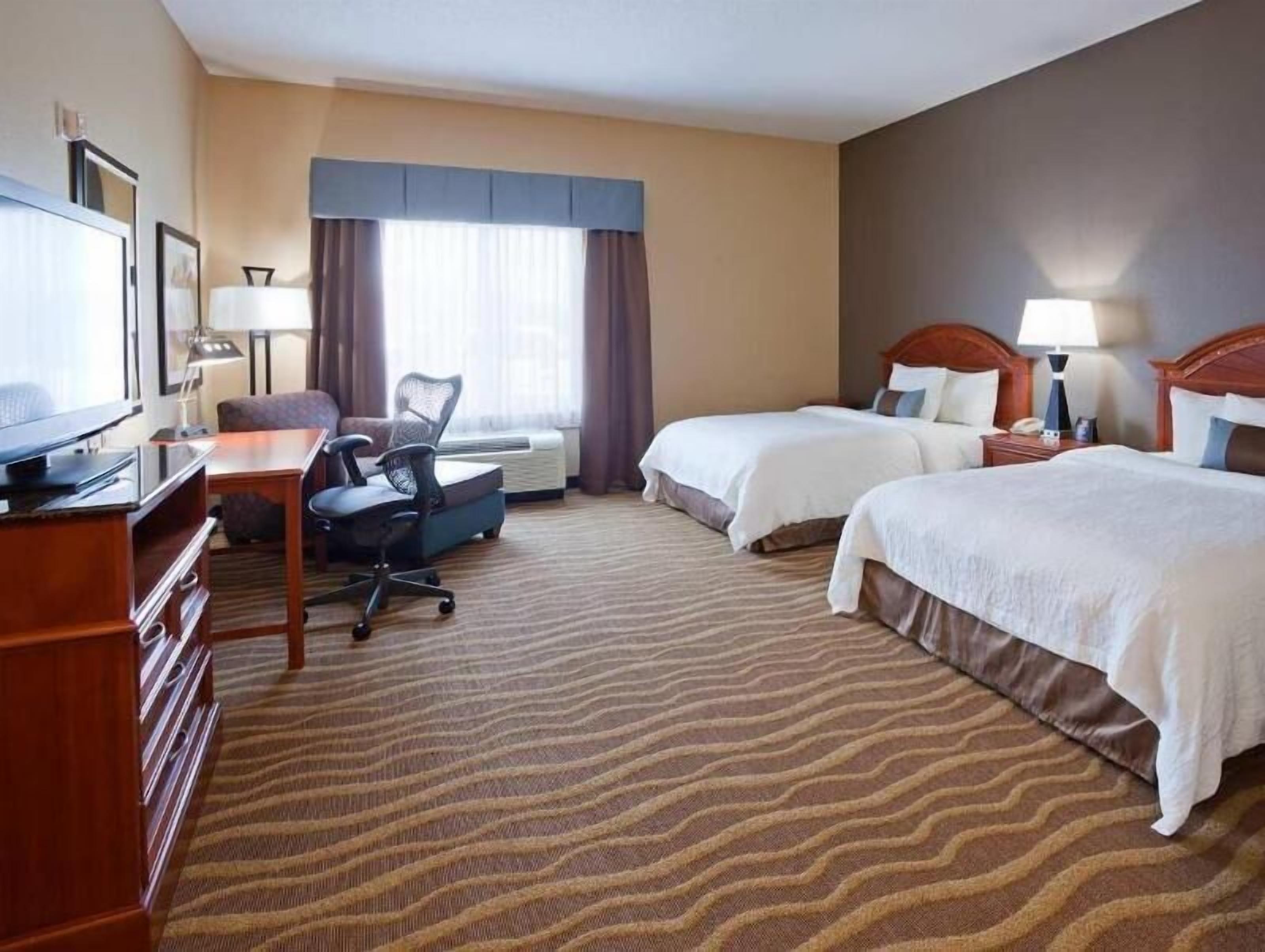 Hypo-allergenic bedding, down comforters, desk, laptop workspace