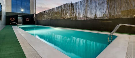 Seasonal outdoor pool, pool umbrellas, pool loungers
