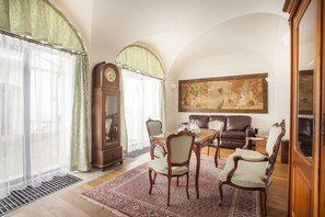 One Bedroom Suite | Living room | 50-inch flat-screen TV with satellite channels, TV - Hotel At the Green Grape (Prague)