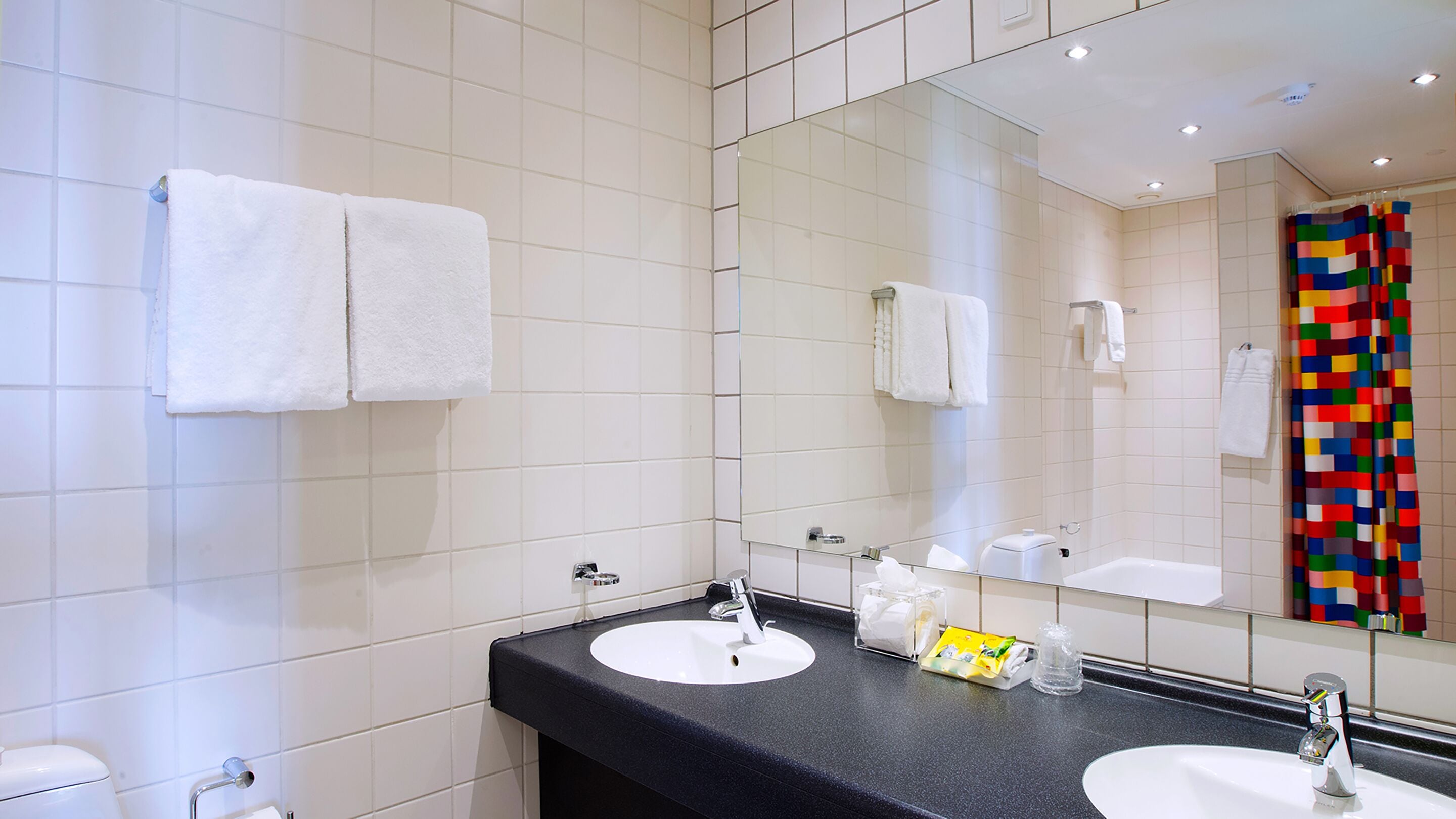 junior suite | bathroom amenities | combined shower/bathtub, free toiletries, hair dryer, towels