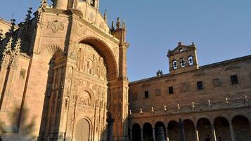 A historic building with intricate carvings and a prominent archway.
