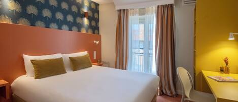 Standard Double Room | Minibar, in-room safe, desk, blackout curtains