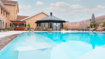 Outdoor pool, open 9:00 AM to 10:00 PM, pool umbrellas, sun loungers