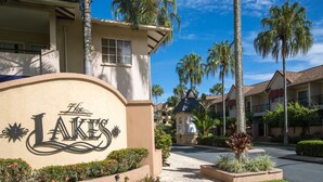 A residential area with a sign reading "The Lakes" and palm trees. - The Lakes Resort Cairns (Cairns North)