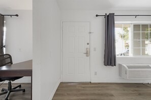 Suite, 1 King Bed | Desk, blackout drapes, iron/ironing board, free WiFi