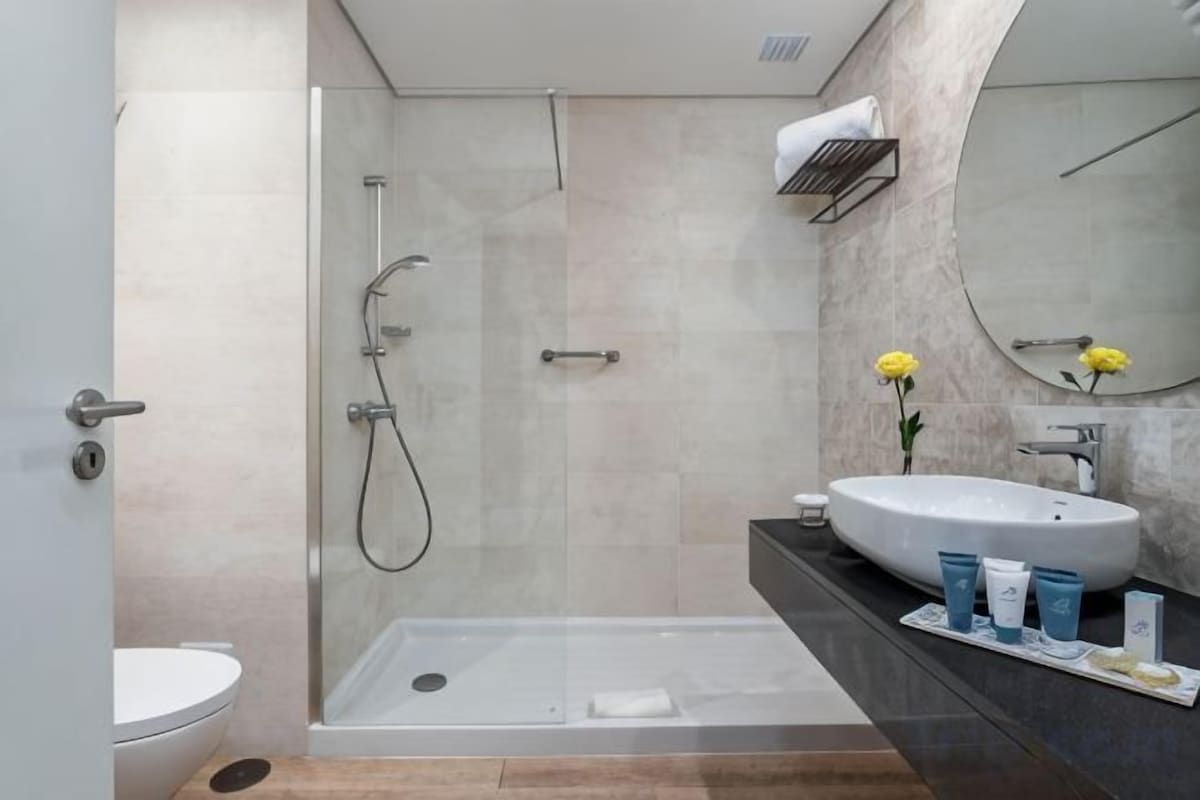 Bathroom | Shower, free toiletries, hair dryer, towels