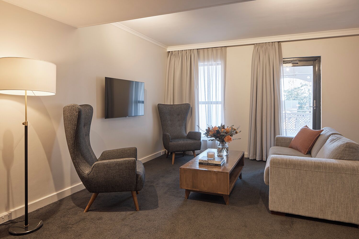 deluxe suite, 1 king bed | living area | 50-inch lcd tv with digital channels, tv, streaming services