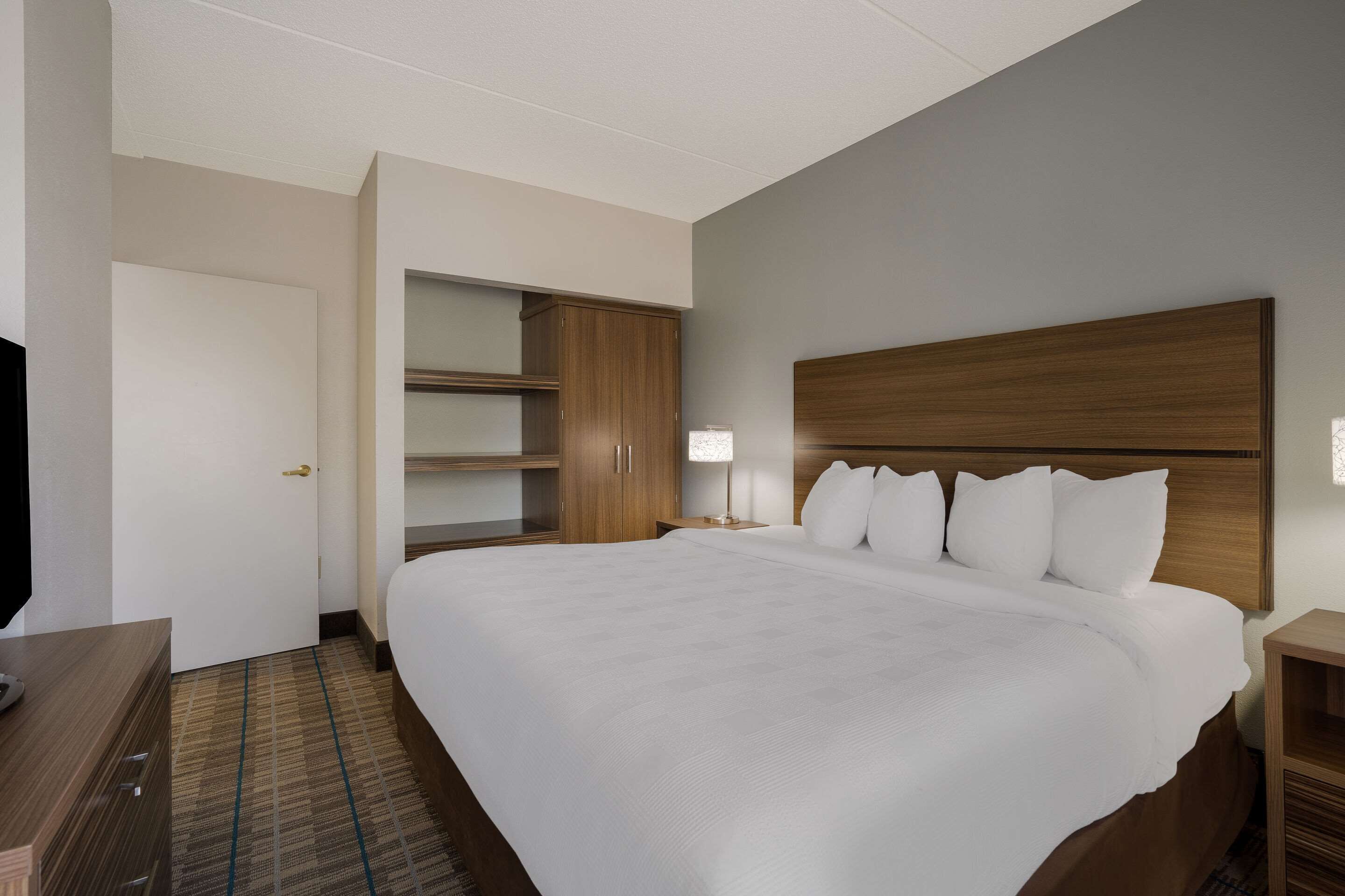 premium bedding, desk, laptop workspace, blackout curtains