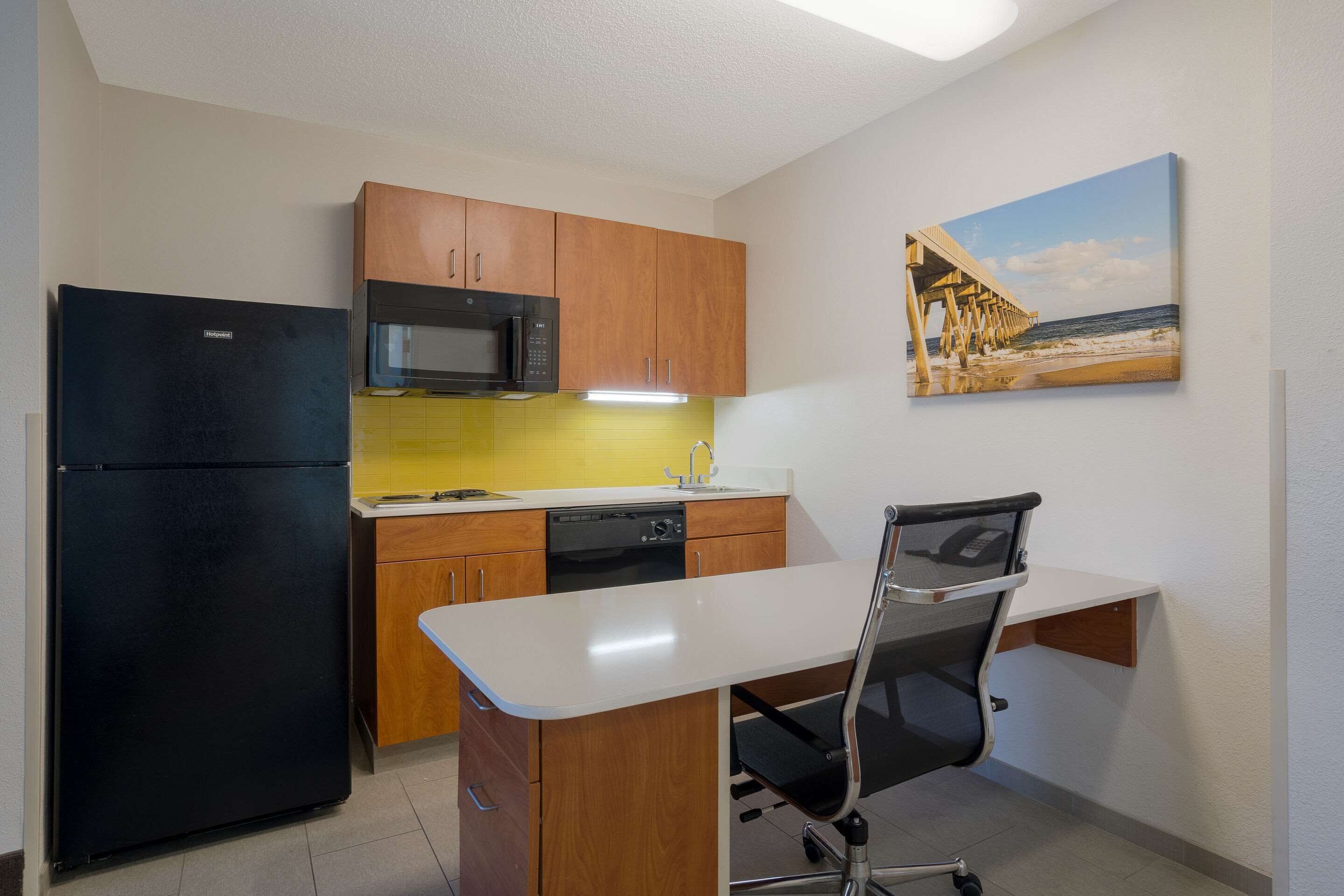 full-sized fridge, microwave, stovetop, dishwasher