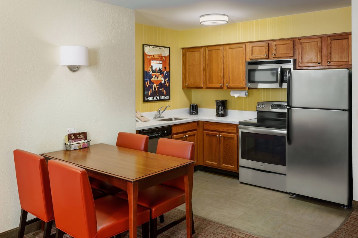 Suite, 2 Bedrooms | Private kitchen | Full-sized fridge, microwave, stovetop, dishwasher