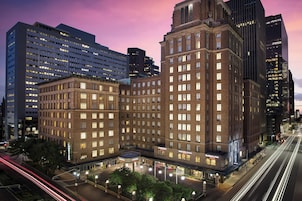 A hotel with a classic architectural style, featuring a prominent entrance and multiple floors.
