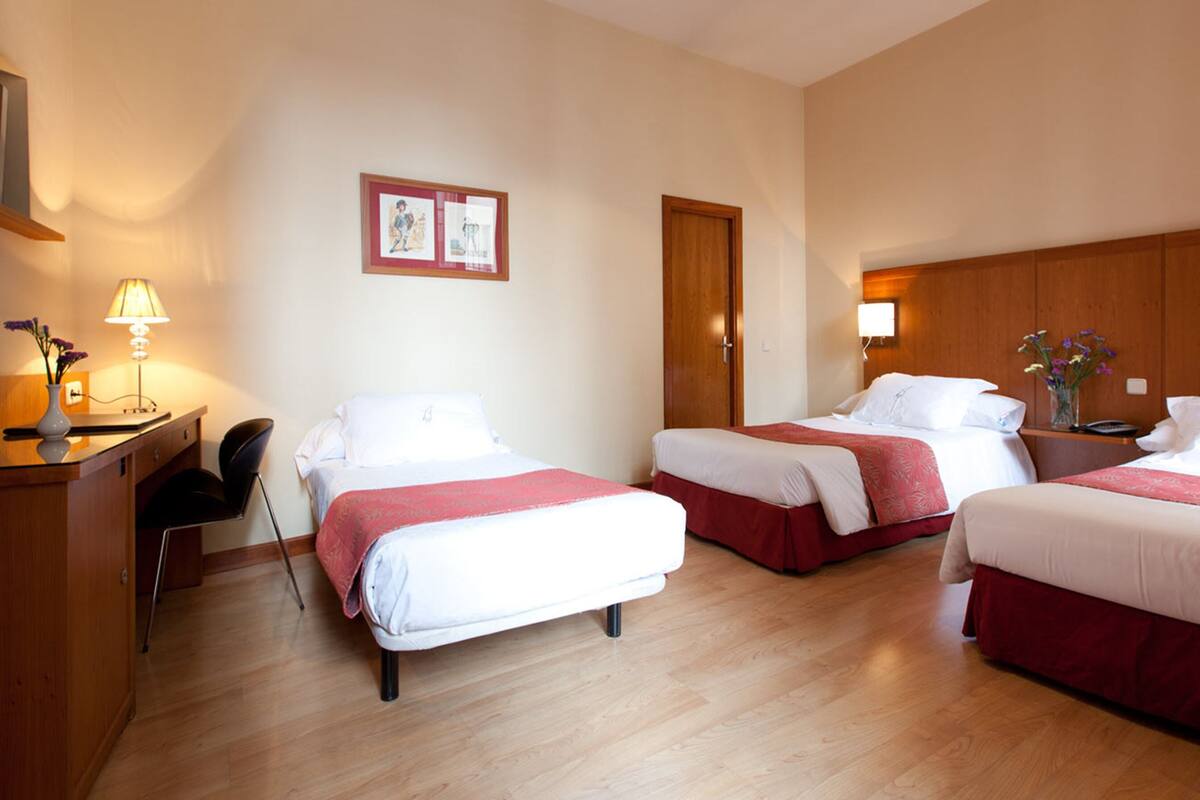 Triple Room | Down comforters, minibar, in-room safe, desk