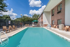 Seasonal outdoor pool, pool loungers