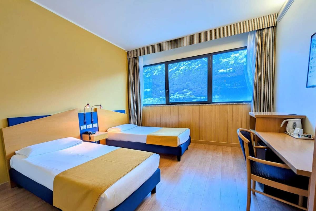 Minibar, desk, blackout drapes, iron/ironing board