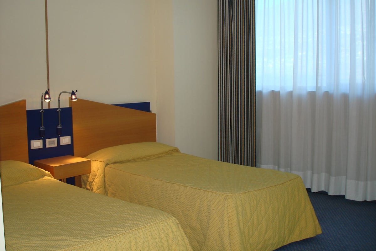 Minibar, desk, blackout curtains, iron/ironing board