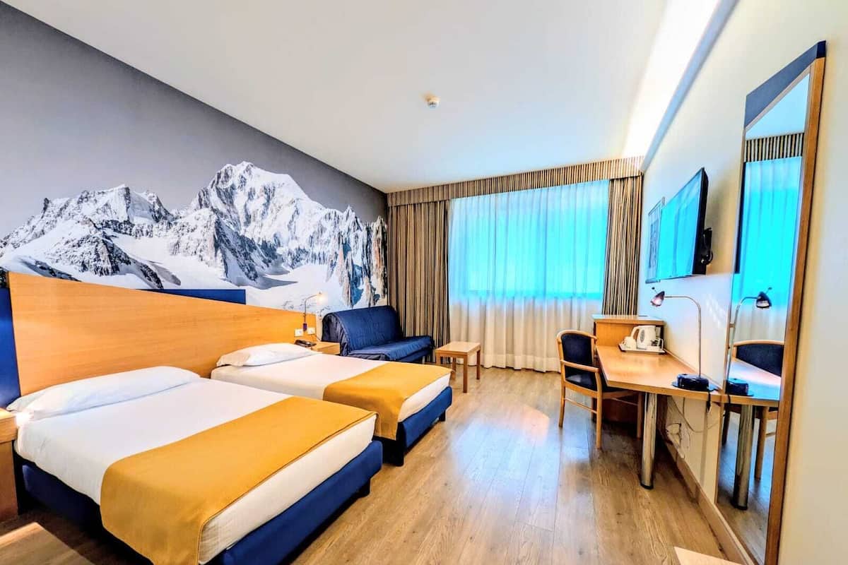 Minibar, desk, blackout drapes, iron/ironing board