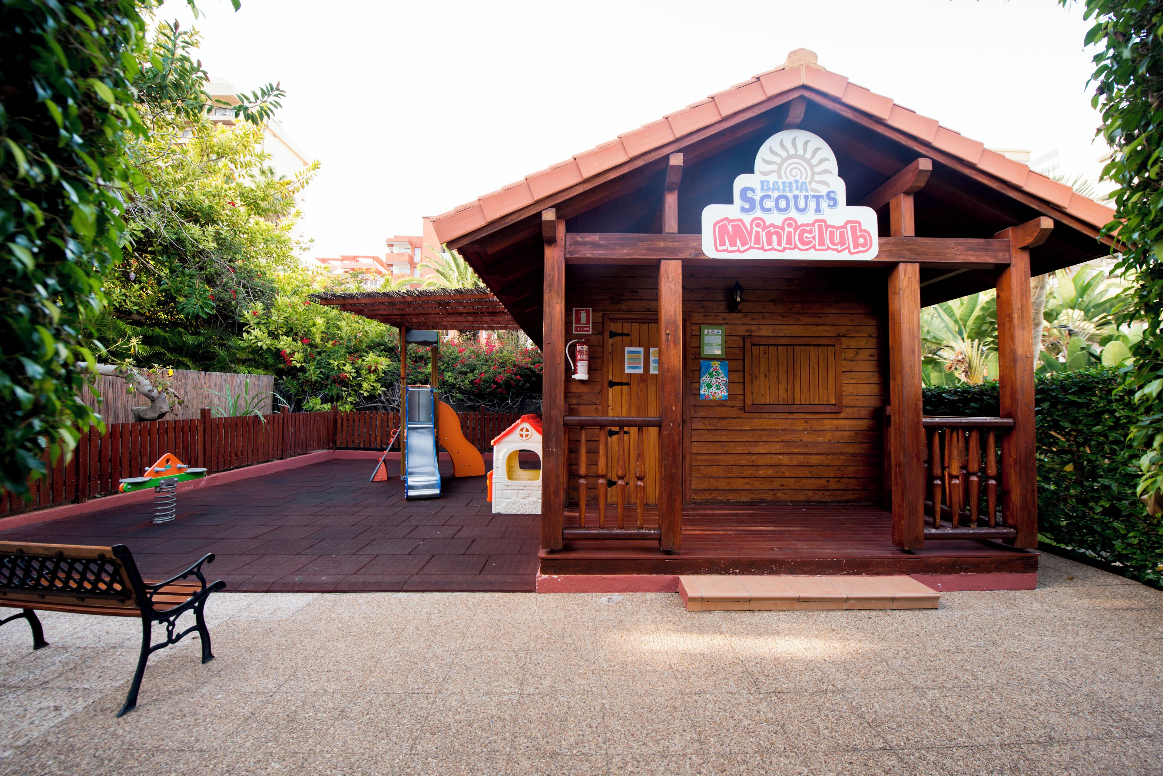 A wooden building with a sign reading "Barra Scout's Miniclub".