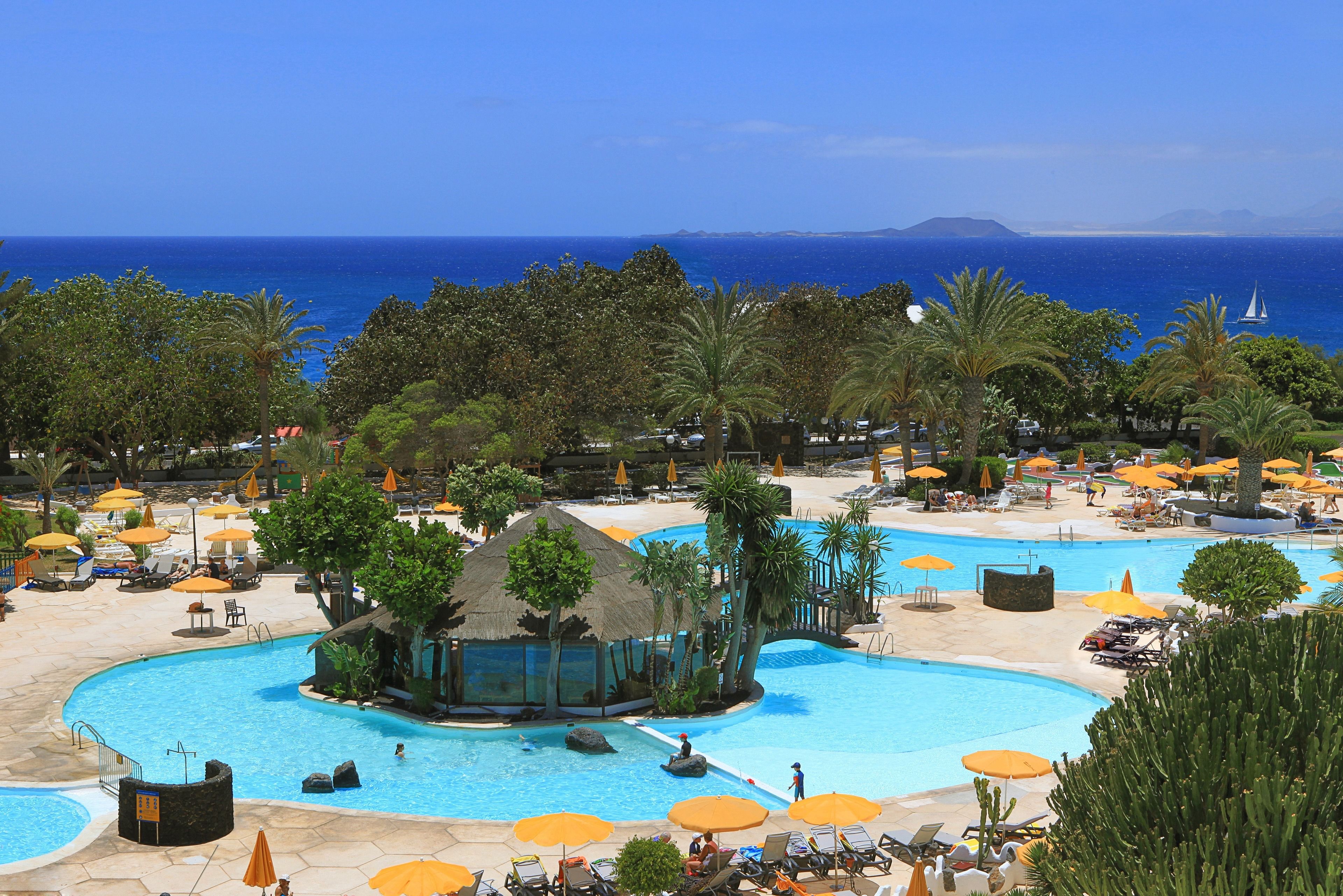 indoor pool, 2 outdoor pools, pool umbrellas, pool loungers