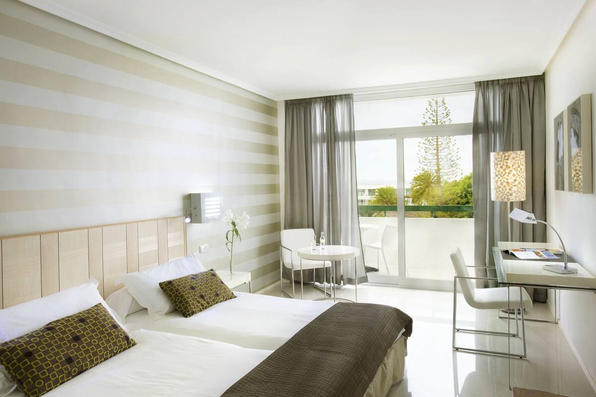Minibar, desk, bed sheets