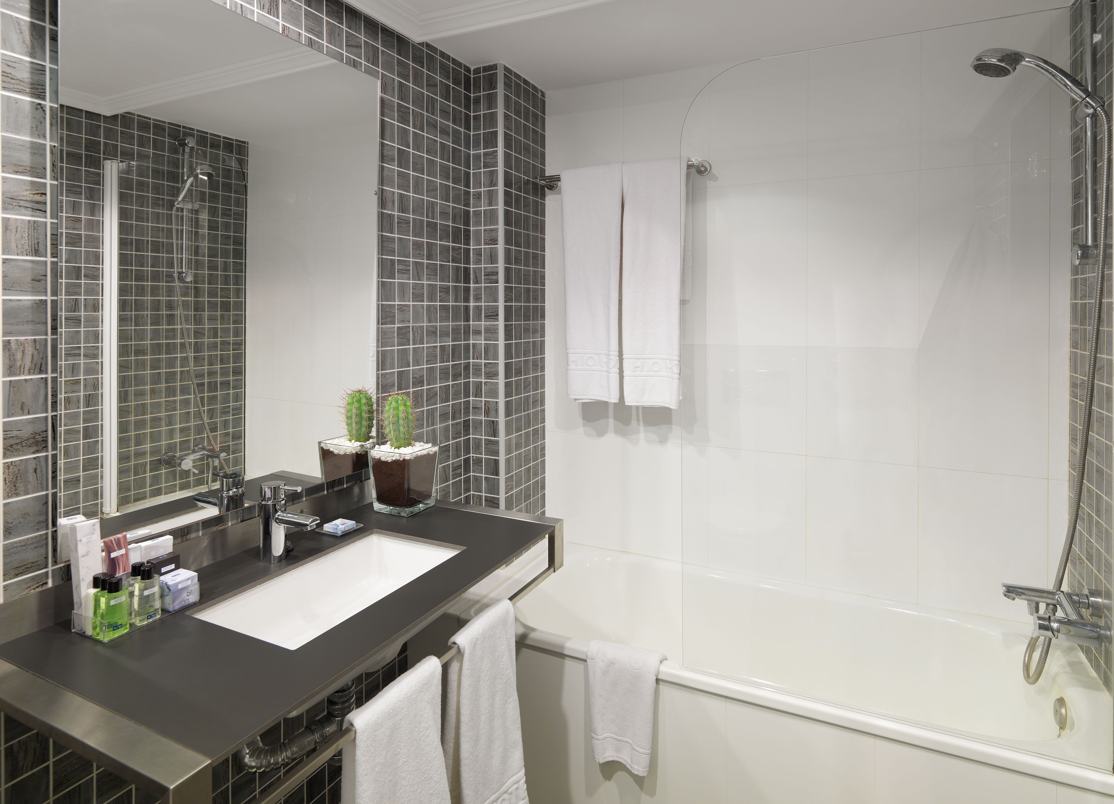 bathtub, eco-friendly toiletries, hair dryer, towels