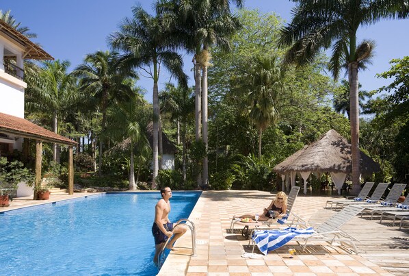 3 outdoor pools, open 7:00 AM to 10:00 PM, pool umbrellas, pool loungers