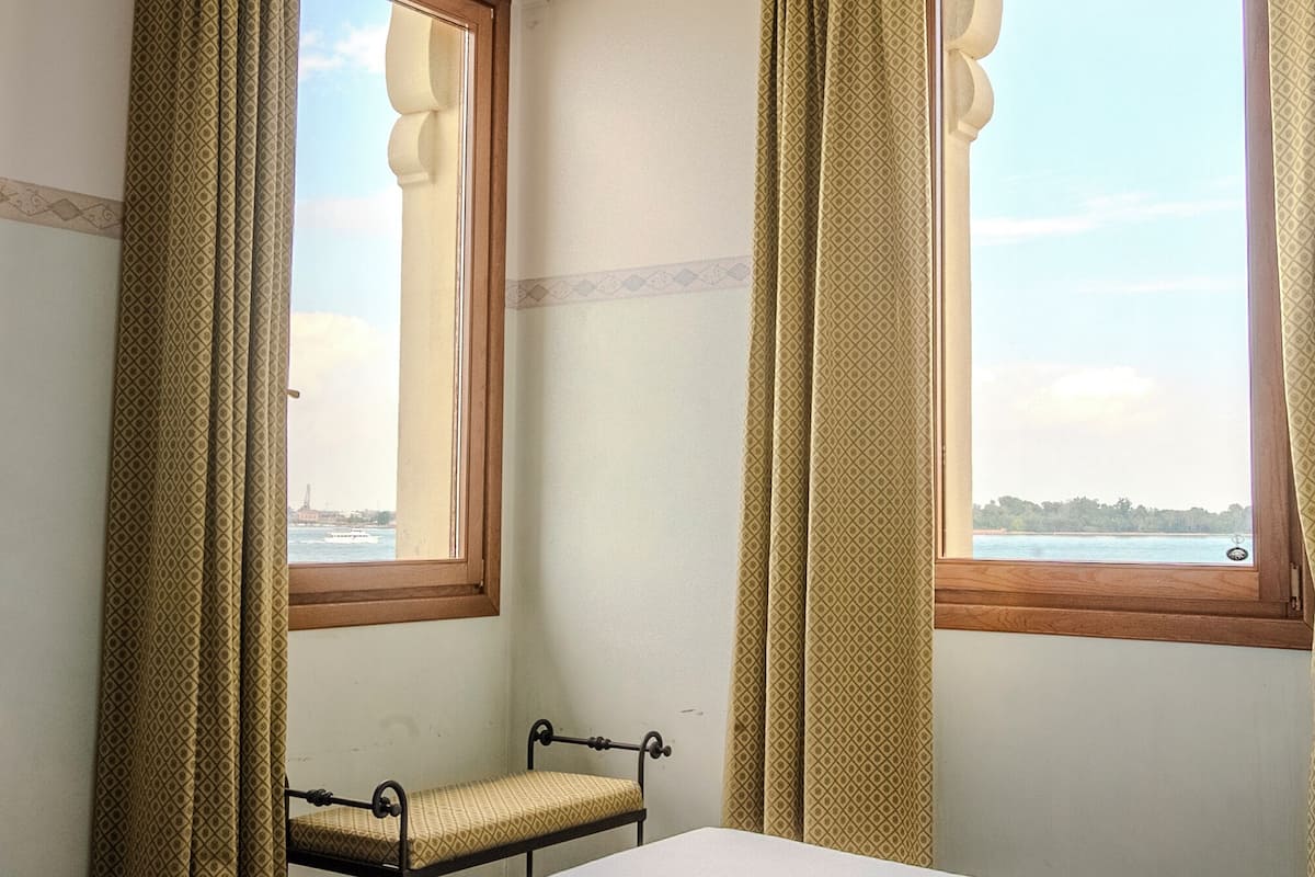 Double Room, Lagoon View | Minibar, in-room safe, desk, blackout drapes