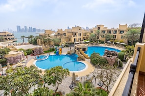 Outdoor pool, open 9:00 AM to 8:00 PM, pool umbrellas, sun loungers