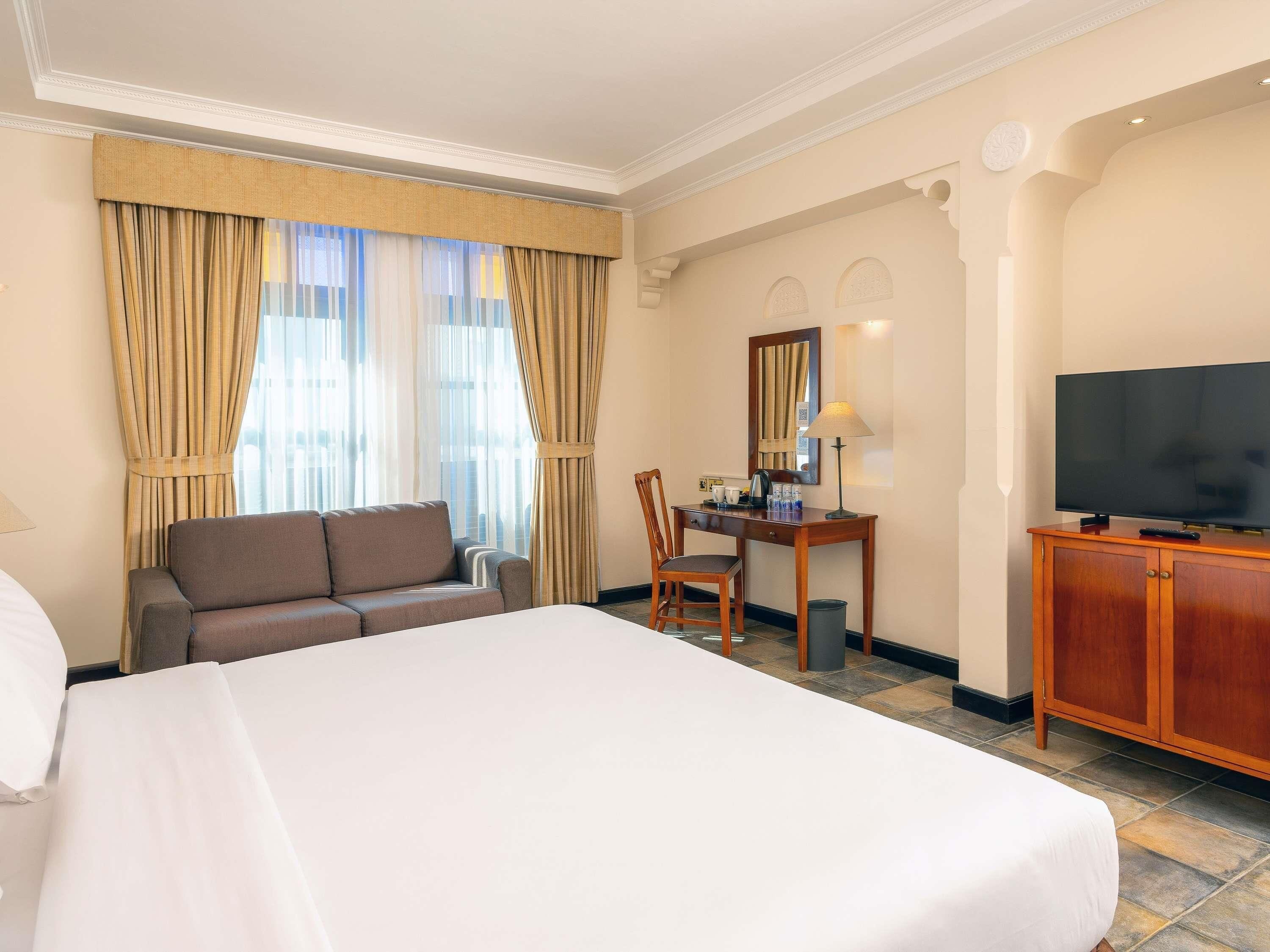 Habitación doble estándar, 1 cama matrimonial | Ropa de cama de alta calidad, edredón y minibar 