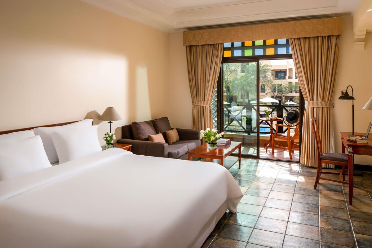 Suite, 1 Queen Bed with Sofa bed, Balcony, Pool View | Premium bedding, down comforters, minibar, in-room safe