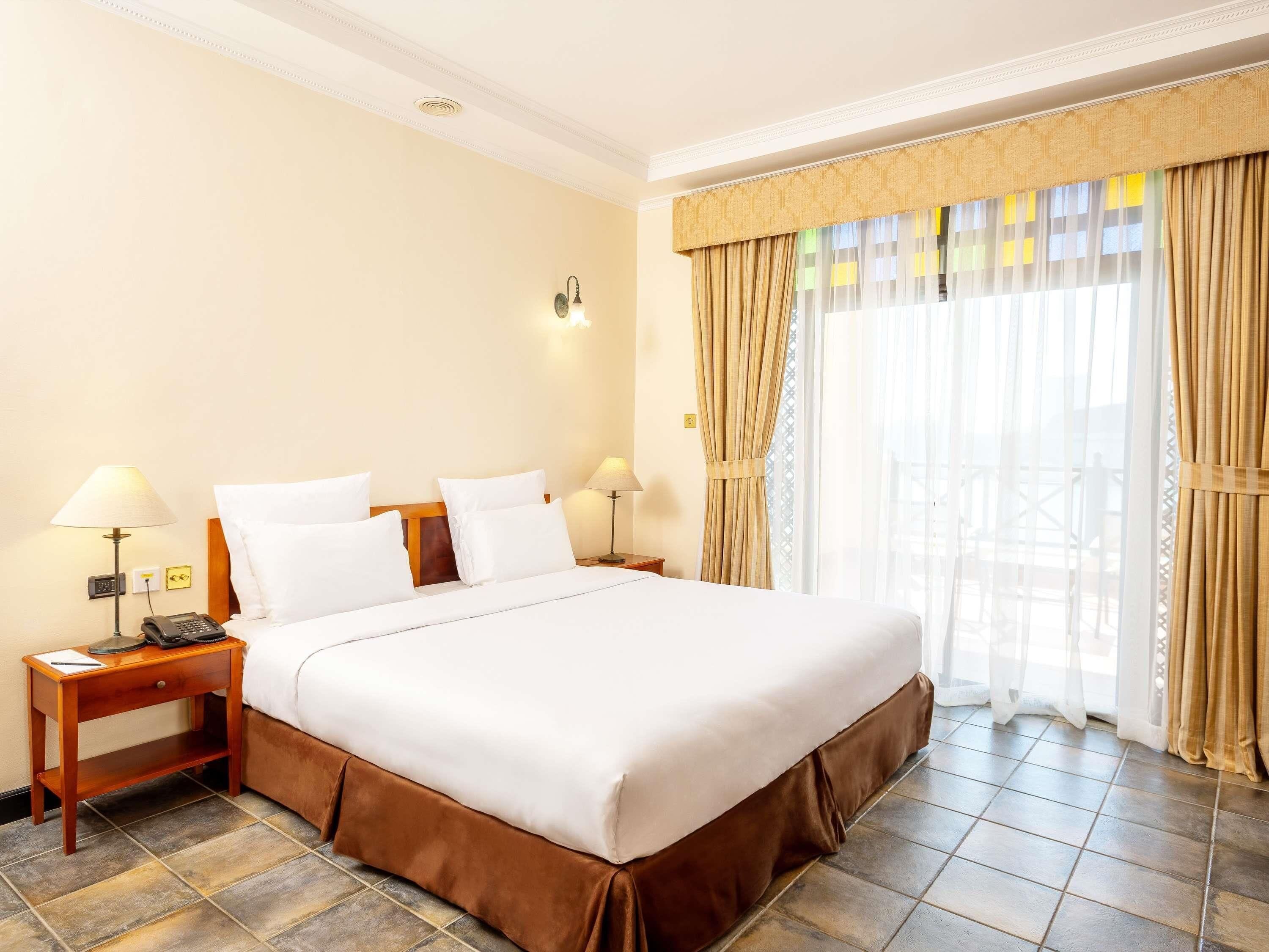 Suite, 1 King Bed, Balcony, Sea View | Premium bedding, down comforters, minibar, in-room safe