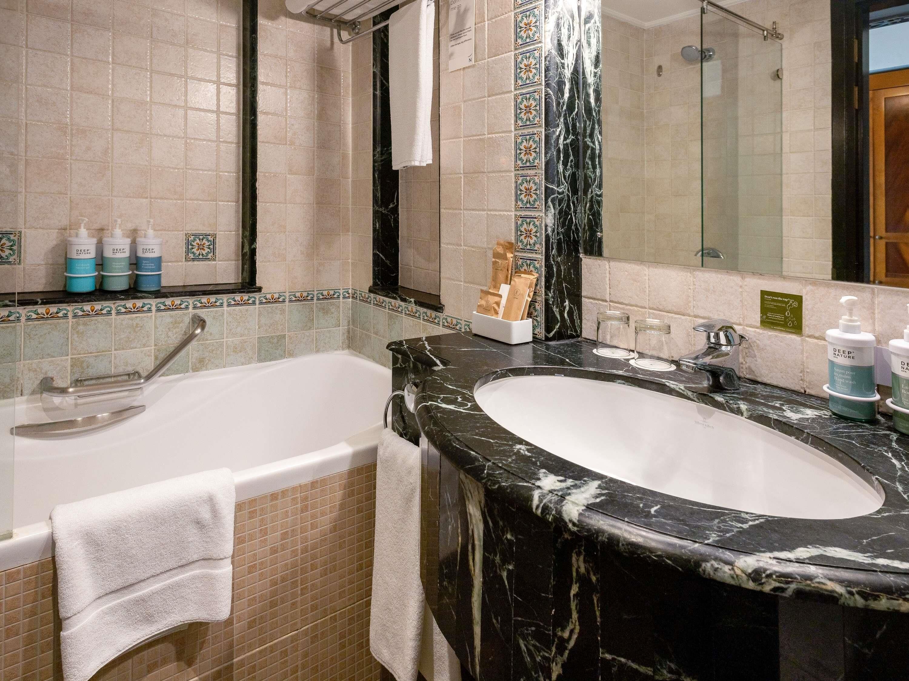 Premium bedding, down comforters, minibar, in-room safe