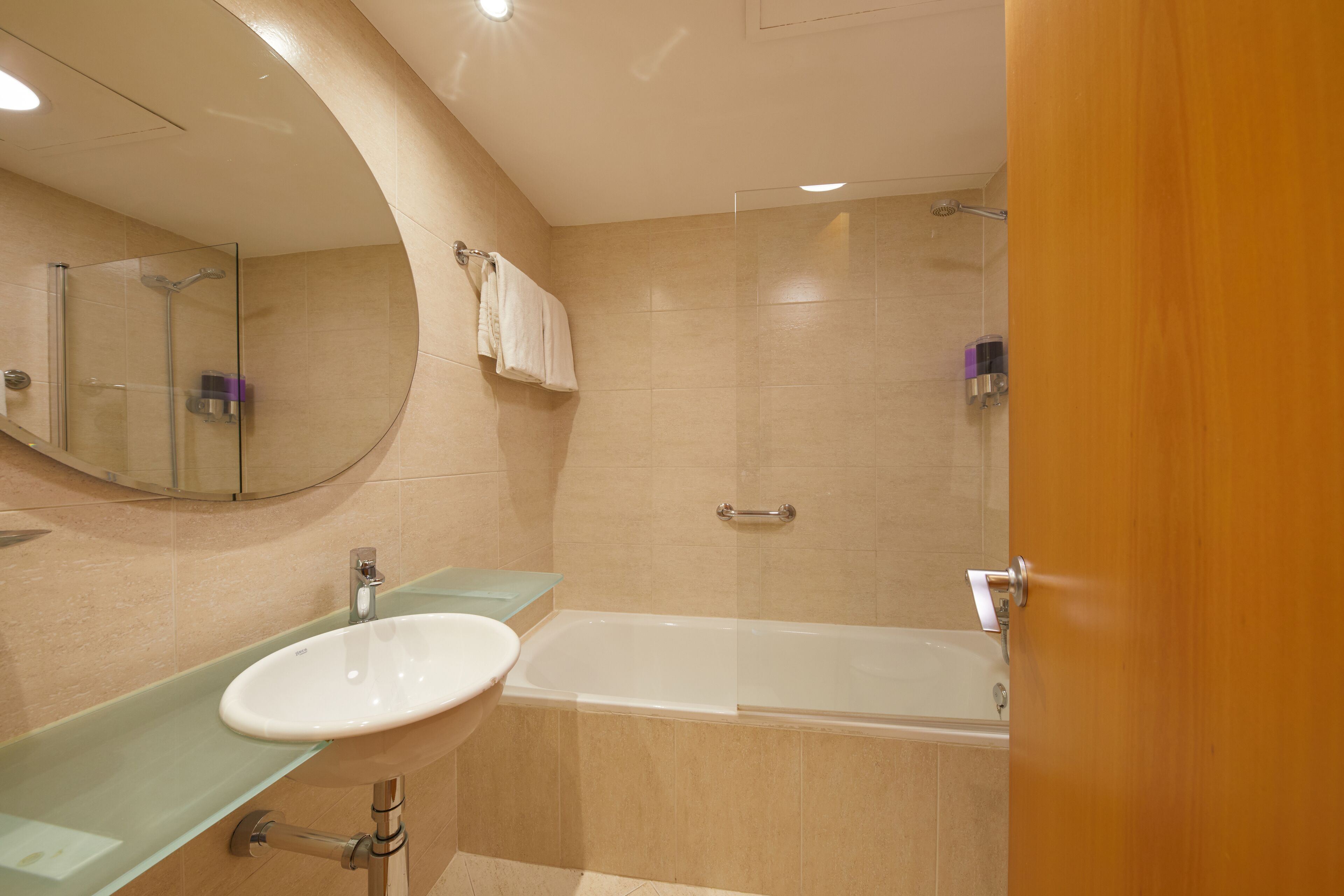 deep-soaking bathtub, eco-friendly toiletries, hair dryer, towels