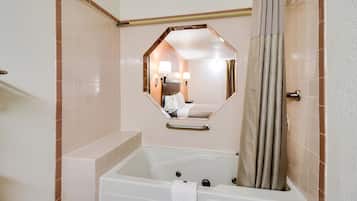 Combined shower/bathtub, towels, soap, shampoo