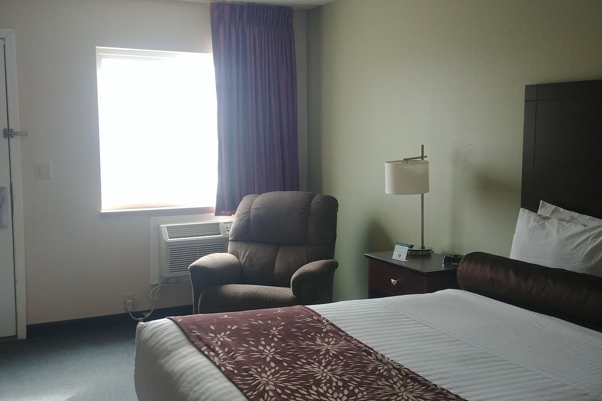 premium bedding, desk, laptop workspace, blackout curtains