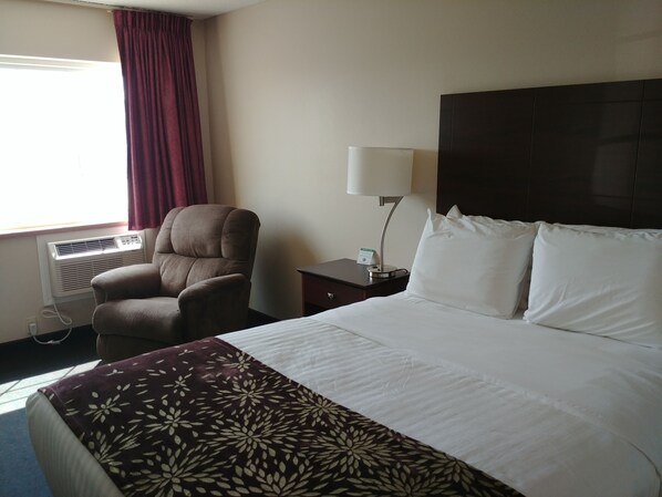 Premium bedding, desk, laptop workspace, blackout curtains