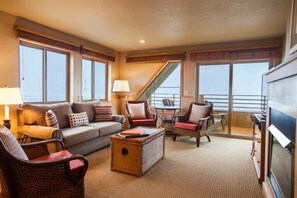 Ocean View Corner Queen Suite with Sofa Sleeper (Not Pet-Friendly) | Living area | 43-inch flat-screen TV with cable channels, TV, fireplace