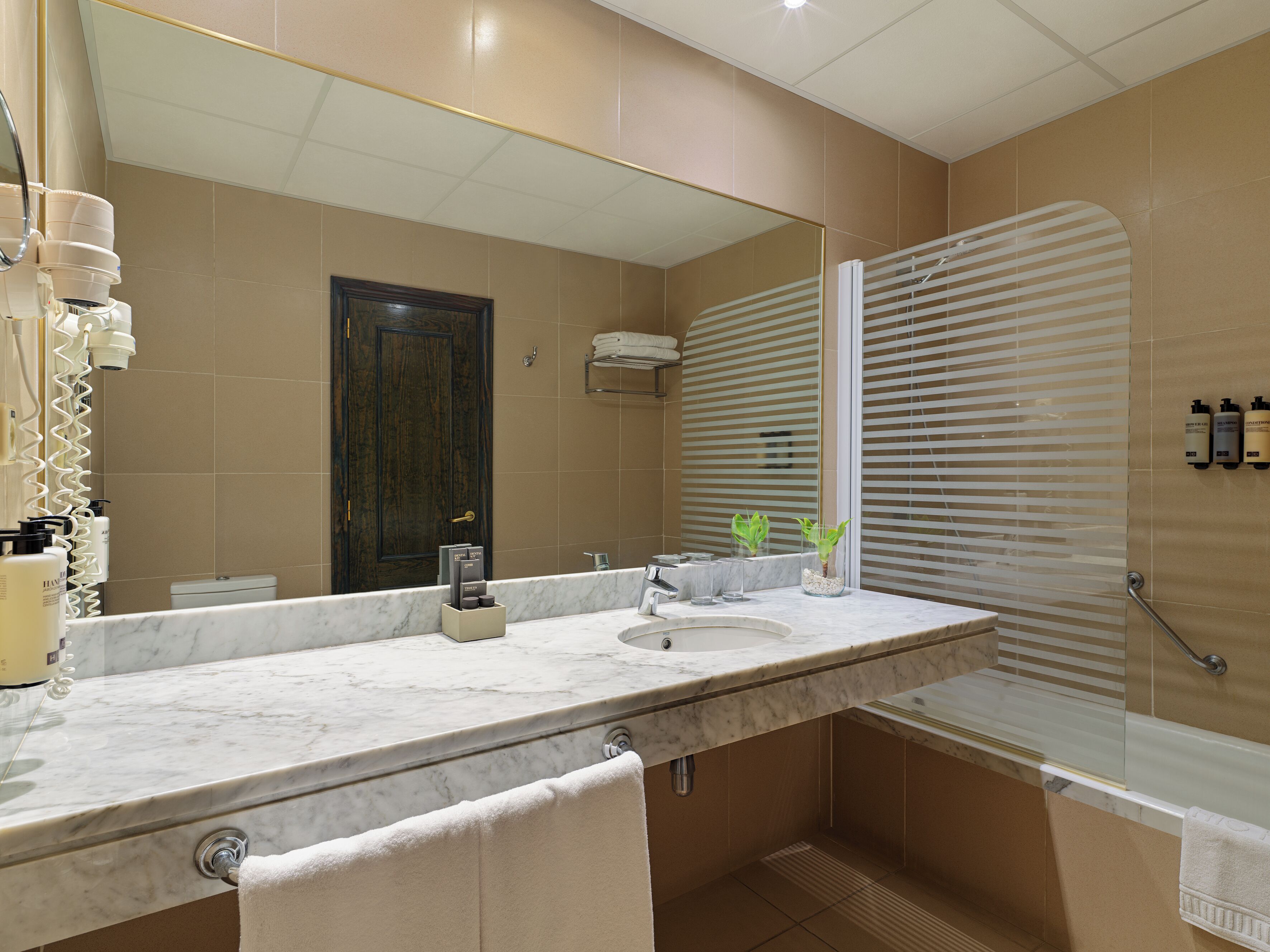 eco-friendly toiletries, hair dryer, towels, soap