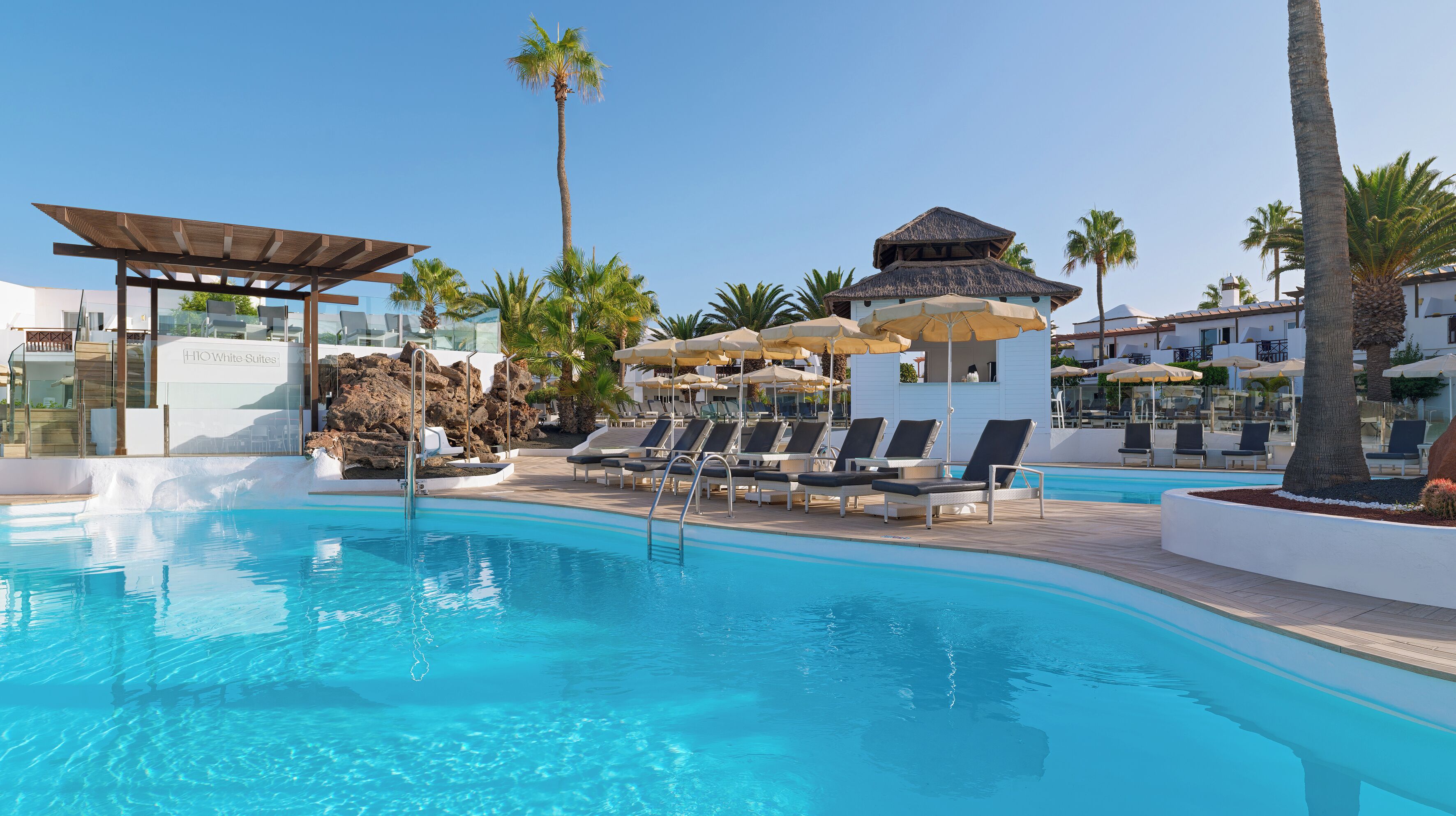 2 outdoor pools, pool umbrellas, pool loungers