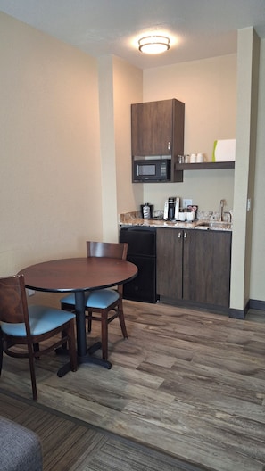 Mini-fridge, microwave, stovetop, coffee/tea maker