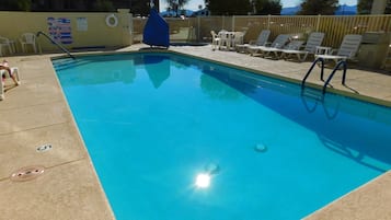 Outdoor pool, a heated pool, sun loungers