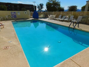 Outdoor pool, a heated pool, pool loungers