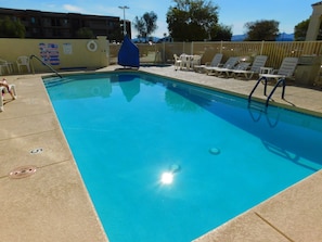 Outdoor pool, a heated pool, sun loungers