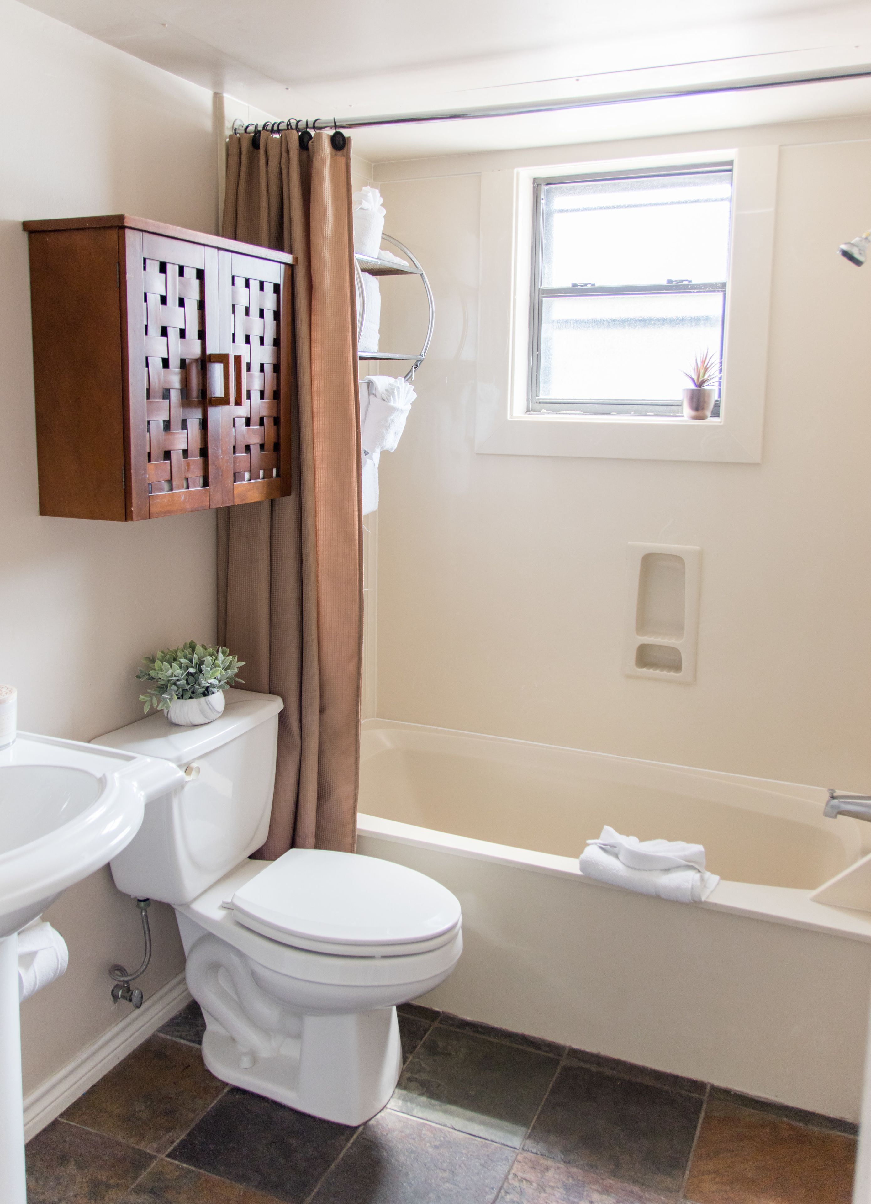 combined shower/bathtub, rainfall showerhead, designer toiletries