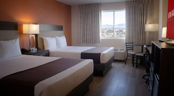 Klondike Deluxe Room - 2 Queens | In-room safe, desk, blackout drapes, iron/ironing board at Arizona Charlies Decatur